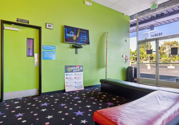 Pump It Up San Jose CA front lobby are where kids watch the safety video on benches.