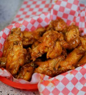 red basket with chicken wings