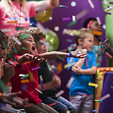 Little girl having fun at her birthday party