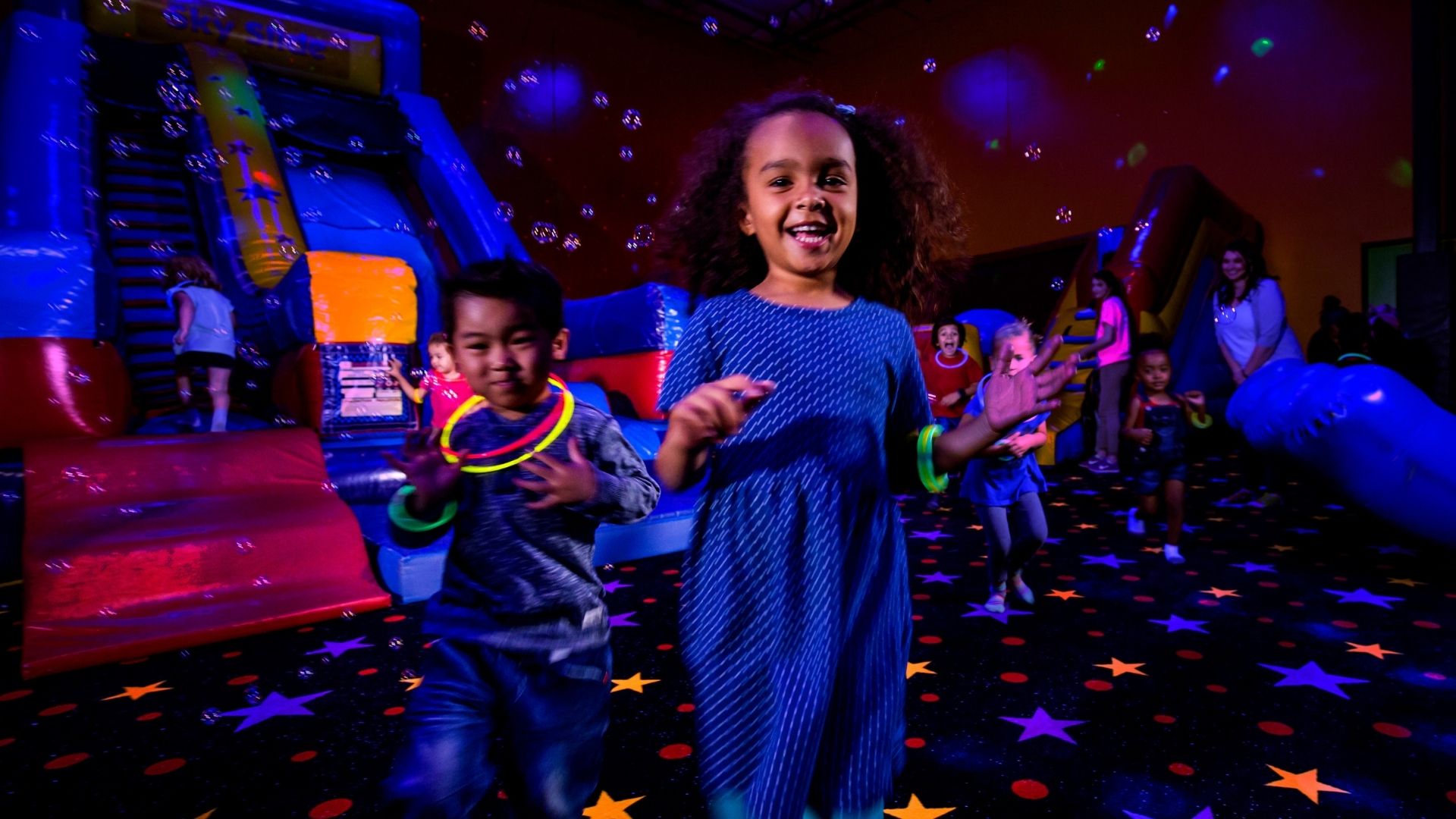 Kids celebrate at the best birthday party place with glow and bubbles
