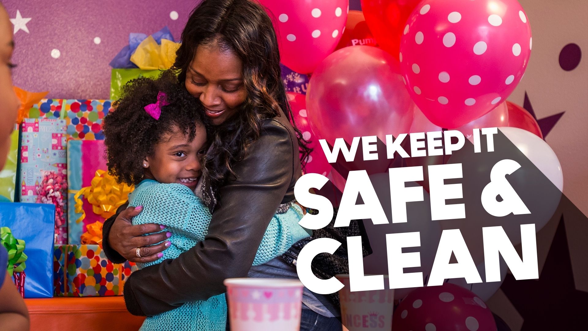 Mom and daughter hugging while celebrating her birthday at Pump It Up where we keep it safe and clean